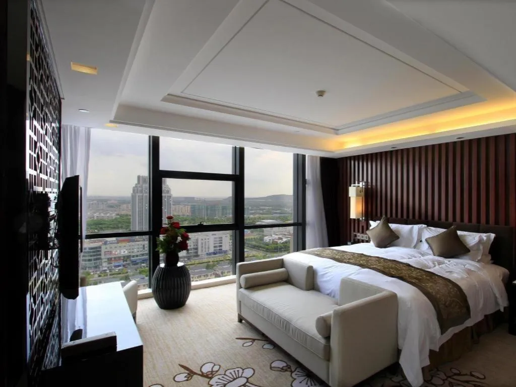 Bed in Zhangjiagang Zhonglian GDH International Hotel