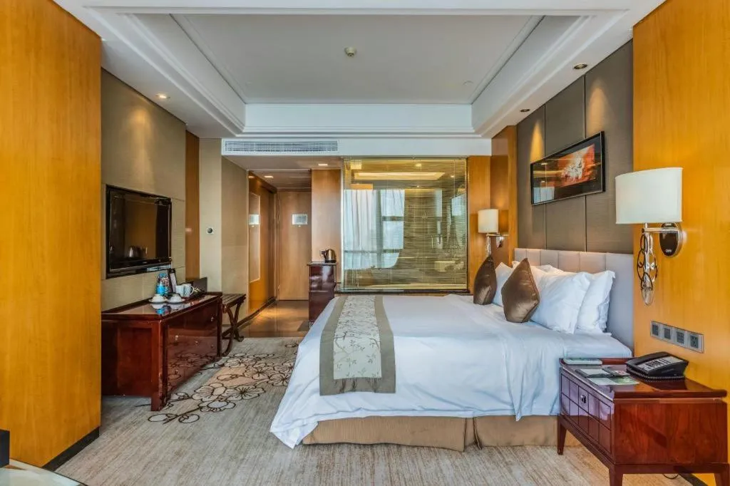 Bed in Zhangjiagang Zhonglian GDH International Hotel