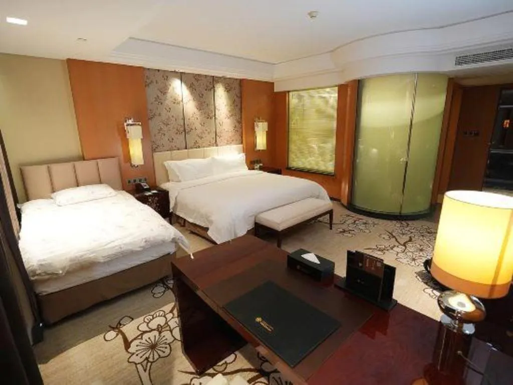 Bed in Zhangjiagang Zhonglian GDH International Hotel
