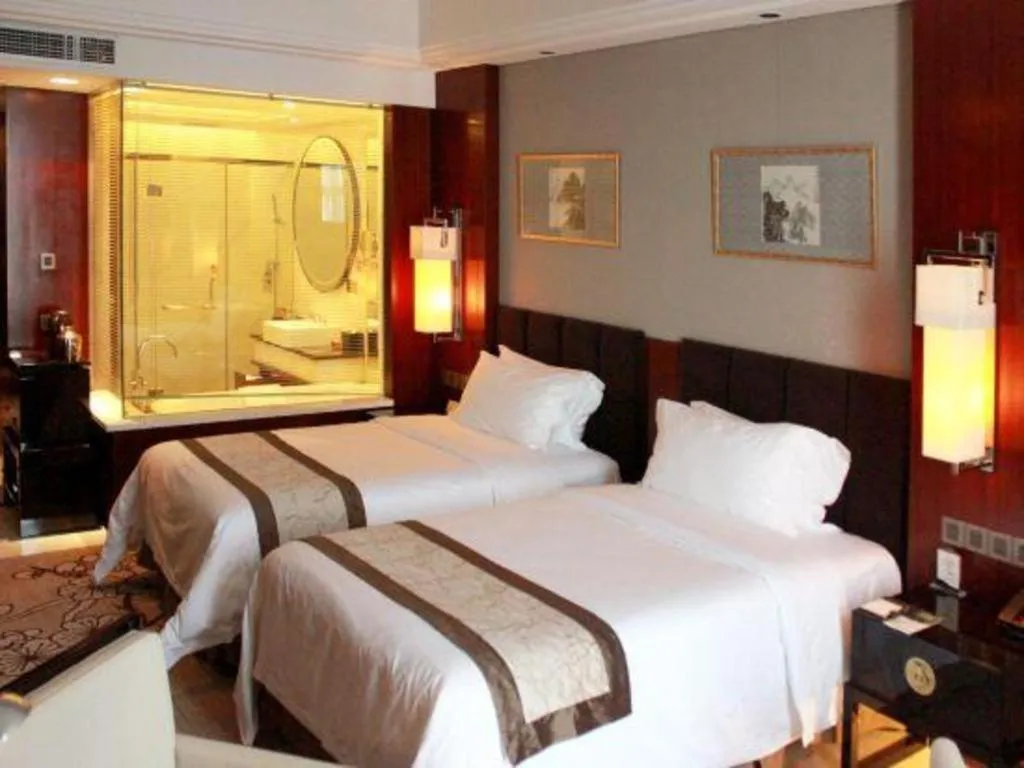 Bed in Zhangjiagang Zhonglian GDH International Hotel