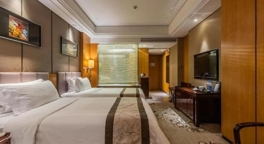 Bed in Zhangjiagang Zhonglian GDH International Hotel