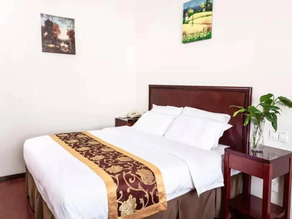 Bed in GreenTree Inn Shanghai Changxing Island Yuansha Fishing Port Hotel