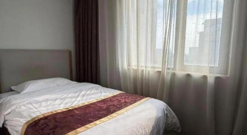 Bed in Xinxiang Zhongzhou Yihe Hotel