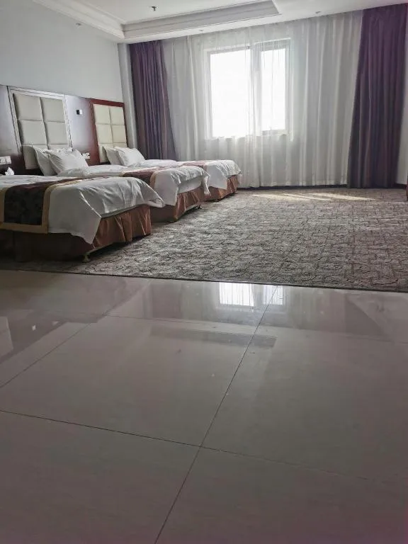 Bed in Xinxiang Zhongzhou Yihe Hotel