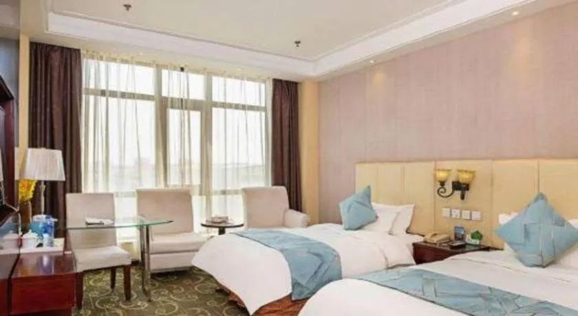 Bed in Xinxiang Zhongzhou Yihe Hotel