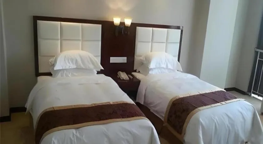Bed in Xinxiang Zhongzhou Yihe Hotel