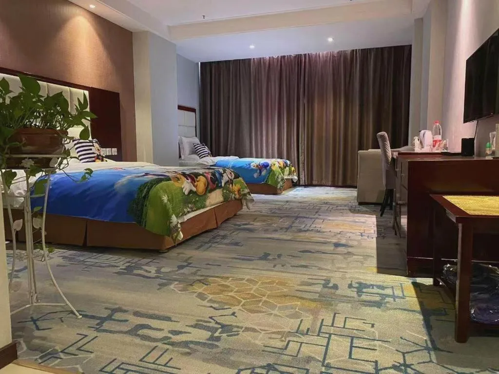 Bed in Xinxiang Zhongzhou Yihe Hotel