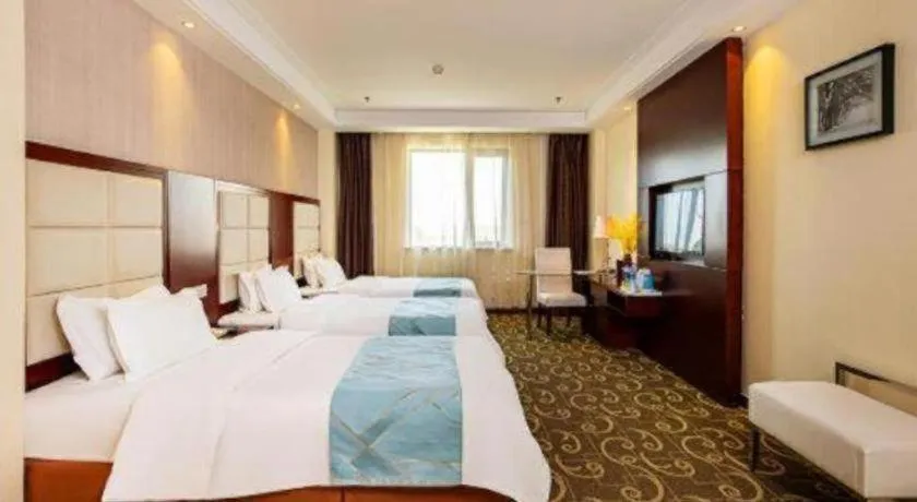 Bed in Xinxiang Zhongzhou Yihe Hotel