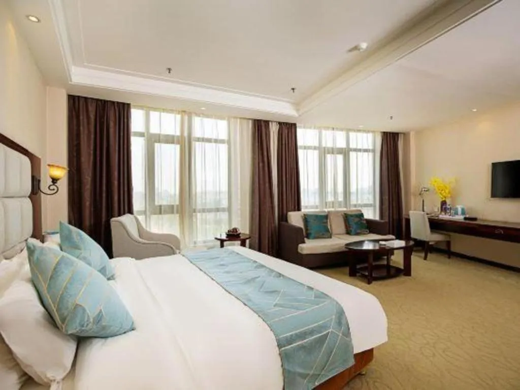 Bed in Xinxiang Zhongzhou Yihe Hotel