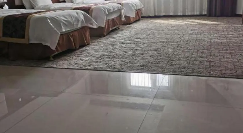 Bed in Xinxiang Zhongzhou Yihe Hotel