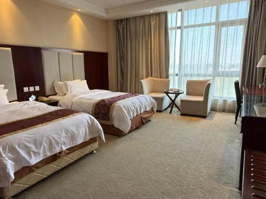 Bed in Xinxiang Zhongzhou Yihe Hotel
