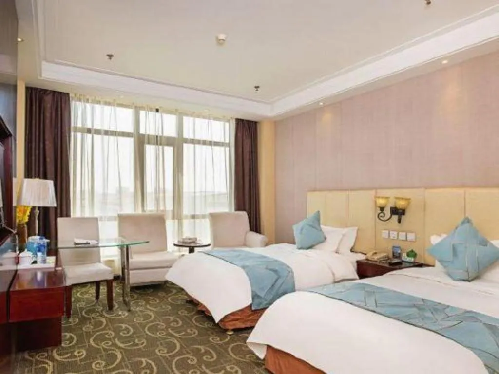 Bed in Xinxiang Zhongzhou Yihe Hotel