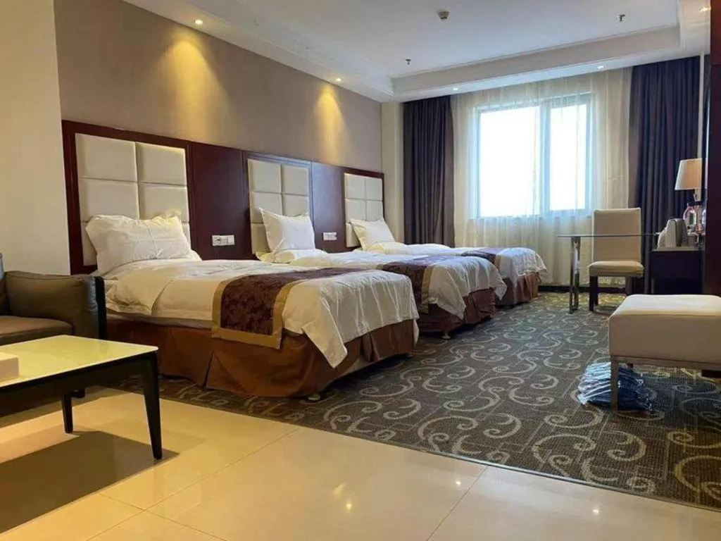 Bed in Xinxiang Zhongzhou Yihe Hotel