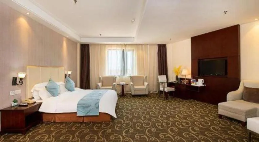 Bed in Xinxiang Zhongzhou Yihe Hotel