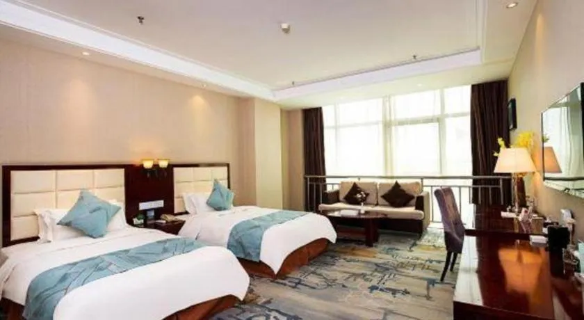 Bed in Xinxiang Zhongzhou Yihe Hotel