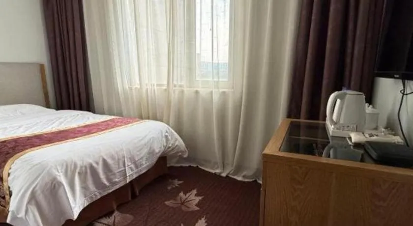 Bed in Xinxiang Zhongzhou Yihe Hotel