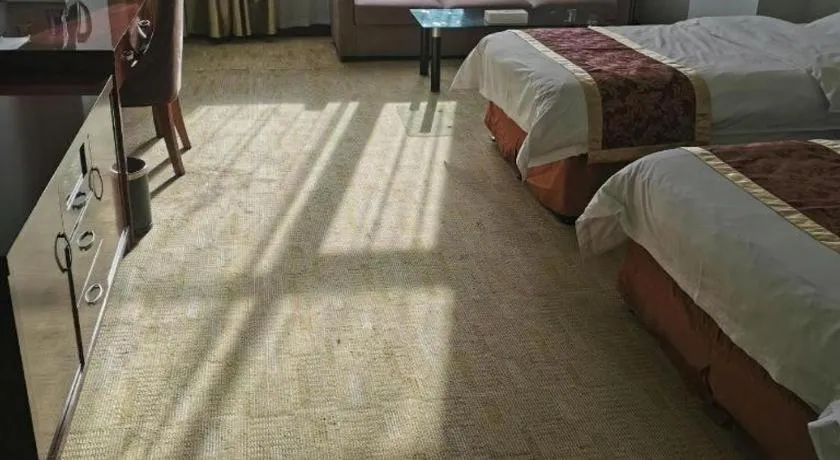 Bed in Xinxiang Zhongzhou Yihe Hotel