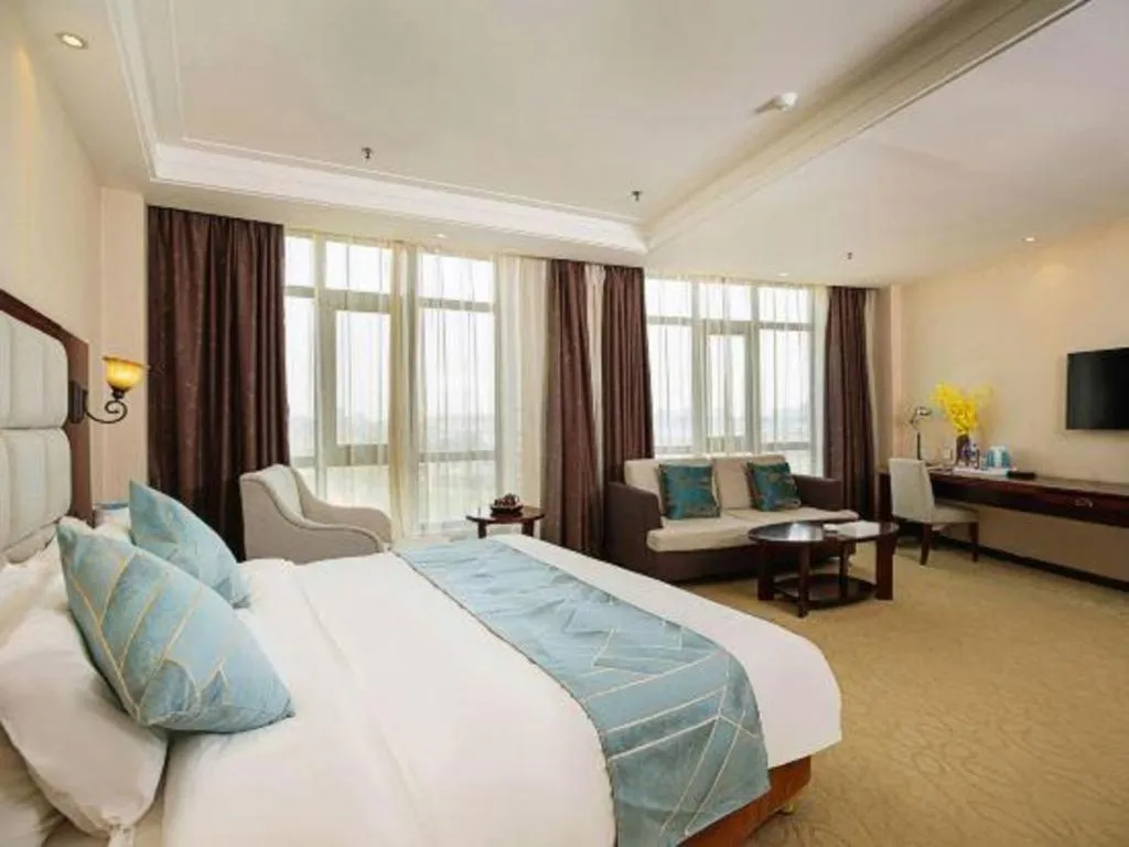 Bed in Xinxiang Zhongzhou Yihe Hotel