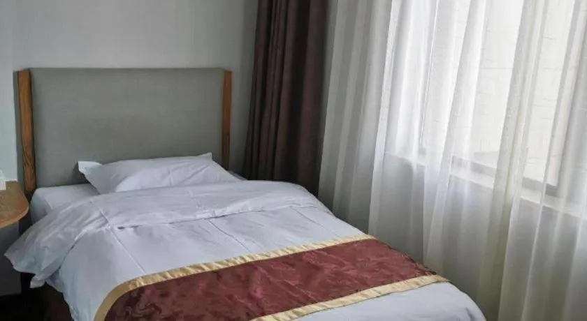 Bed in Xinxiang Zhongzhou Yihe Hotel