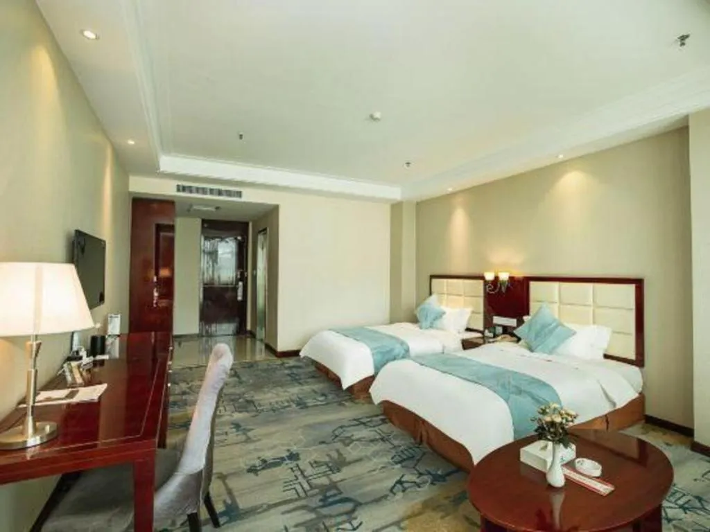 Bed in Xinxiang Zhongzhou Yihe Hotel