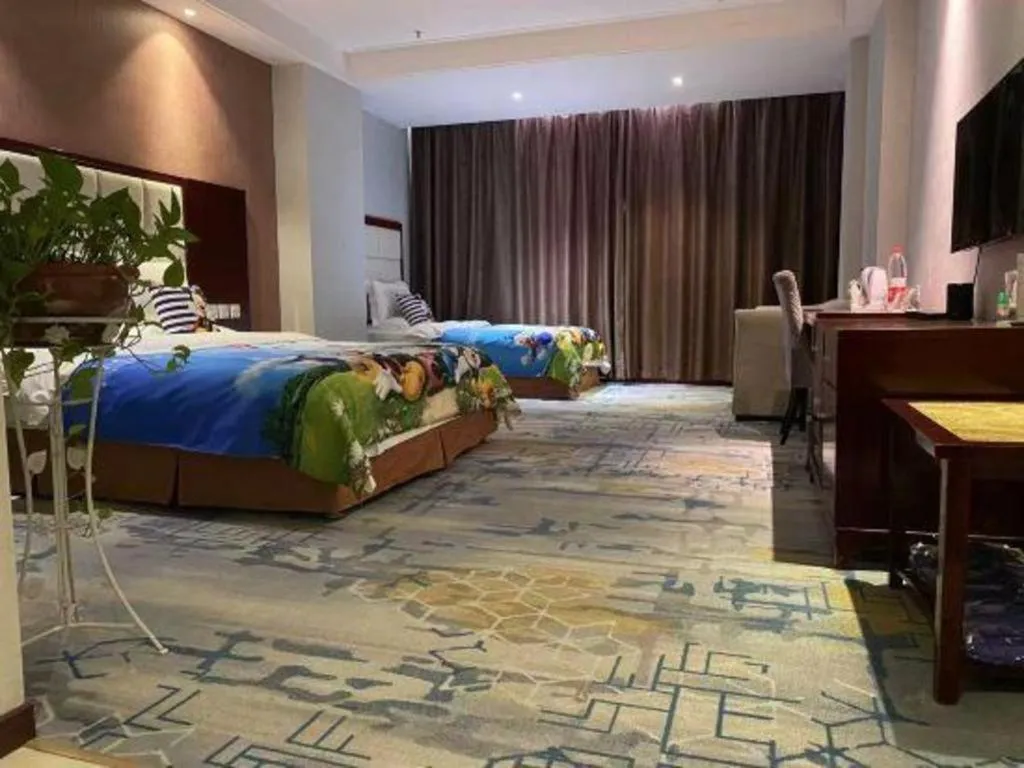 Bed in Xinxiang Zhongzhou Yihe Hotel