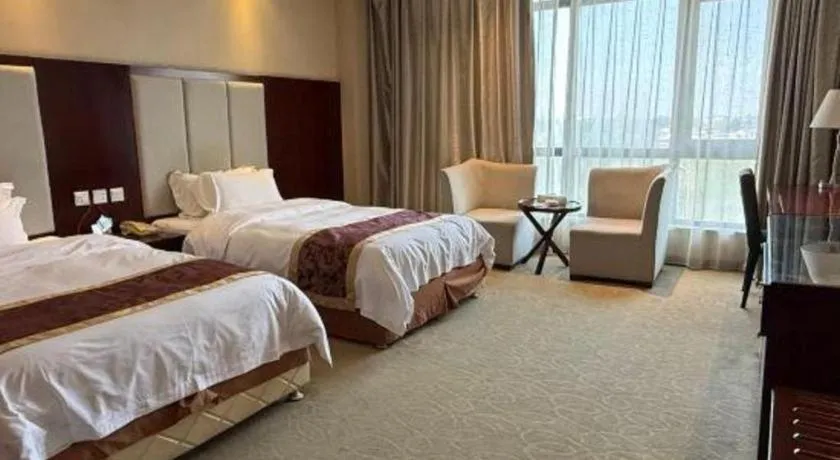 Bed in Xinxiang Zhongzhou Yihe Hotel