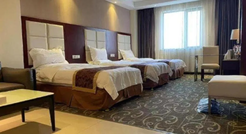 Bed in Xinxiang Zhongzhou Yihe Hotel