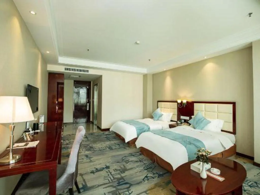 Bed in Xinxiang Zhongzhou Yihe Hotel