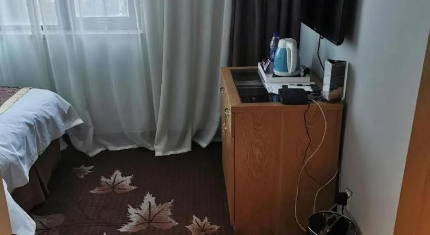 Bed in Xinxiang Zhongzhou Yihe Hotel