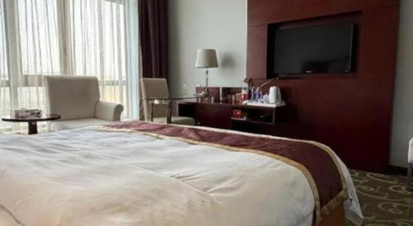 Bed in Xinxiang Zhongzhou Yihe Hotel