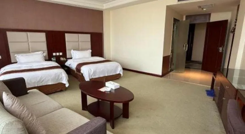 Bed in Xinxiang Zhongzhou Yihe Hotel