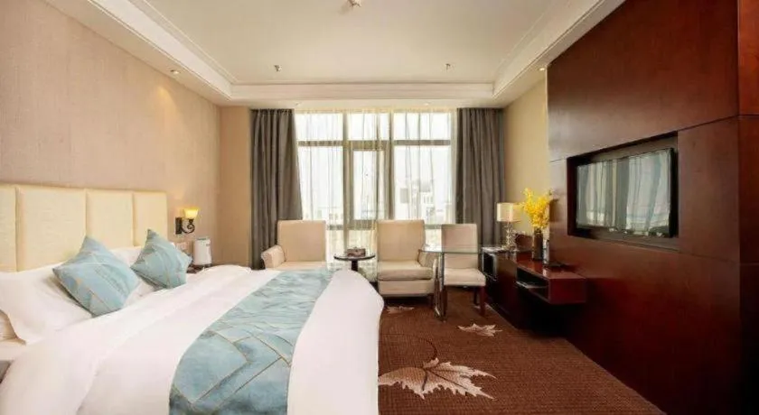 Bed in Xinxiang Zhongzhou Yihe Hotel