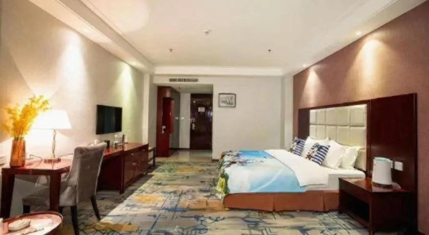 Bed in Xinxiang Zhongzhou Yihe Hotel