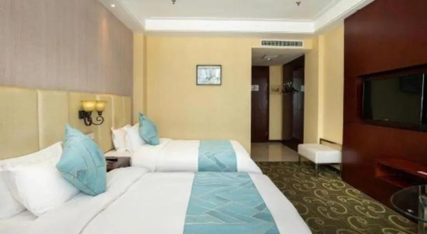 Bed in Xinxiang Zhongzhou Yihe Hotel