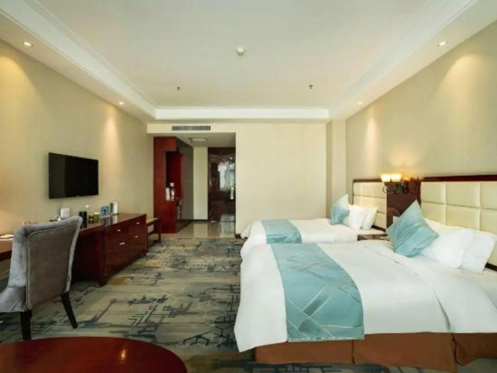 Bed in Xinxiang Zhongzhou Yihe Hotel