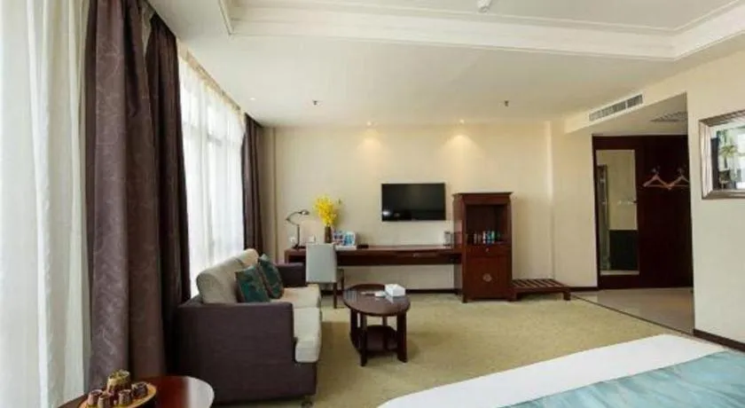 Bed in Xinxiang Zhongzhou Yihe Hotel