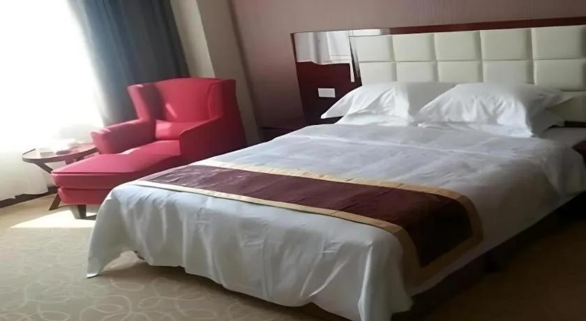Bed in Xinxiang Zhongzhou Yihe Hotel