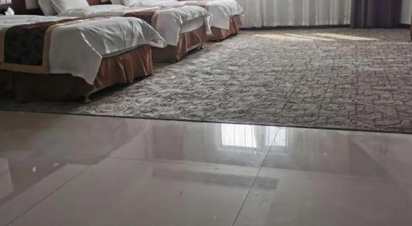 Bed in Xinxiang Zhongzhou Yihe Hotel