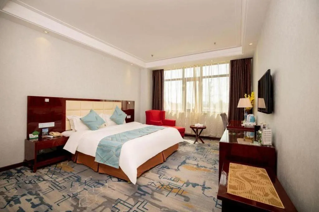 Bed in Xinxiang Zhongzhou Yihe Hotel