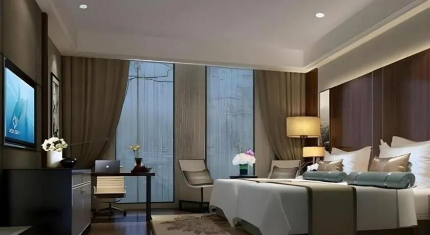 Bed in Jiyuan Oriental Jianguo Hotel