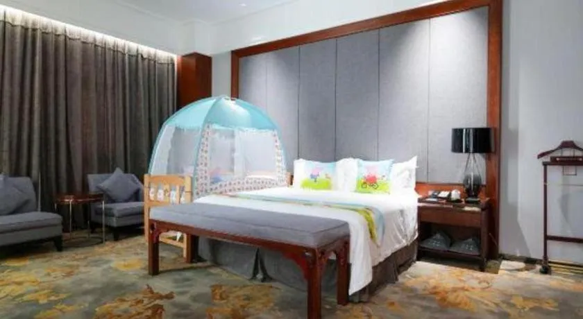 Bed in Jiyuan Oriental Jianguo Hotel