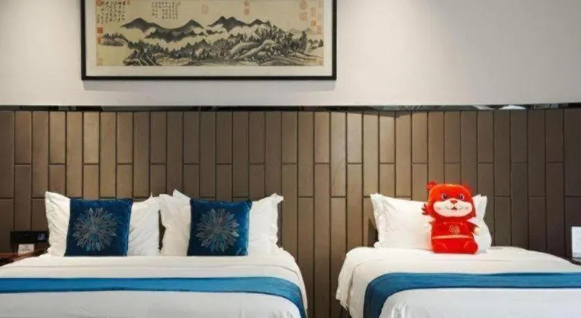 Bed in Jiyuan Oriental Jianguo Hotel