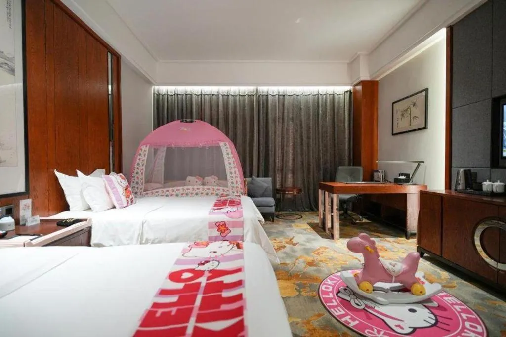 Bed in Jiyuan Oriental Jianguo Hotel