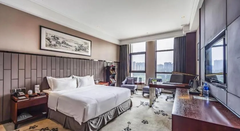 Bed in Jiyuan Oriental Jianguo Hotel