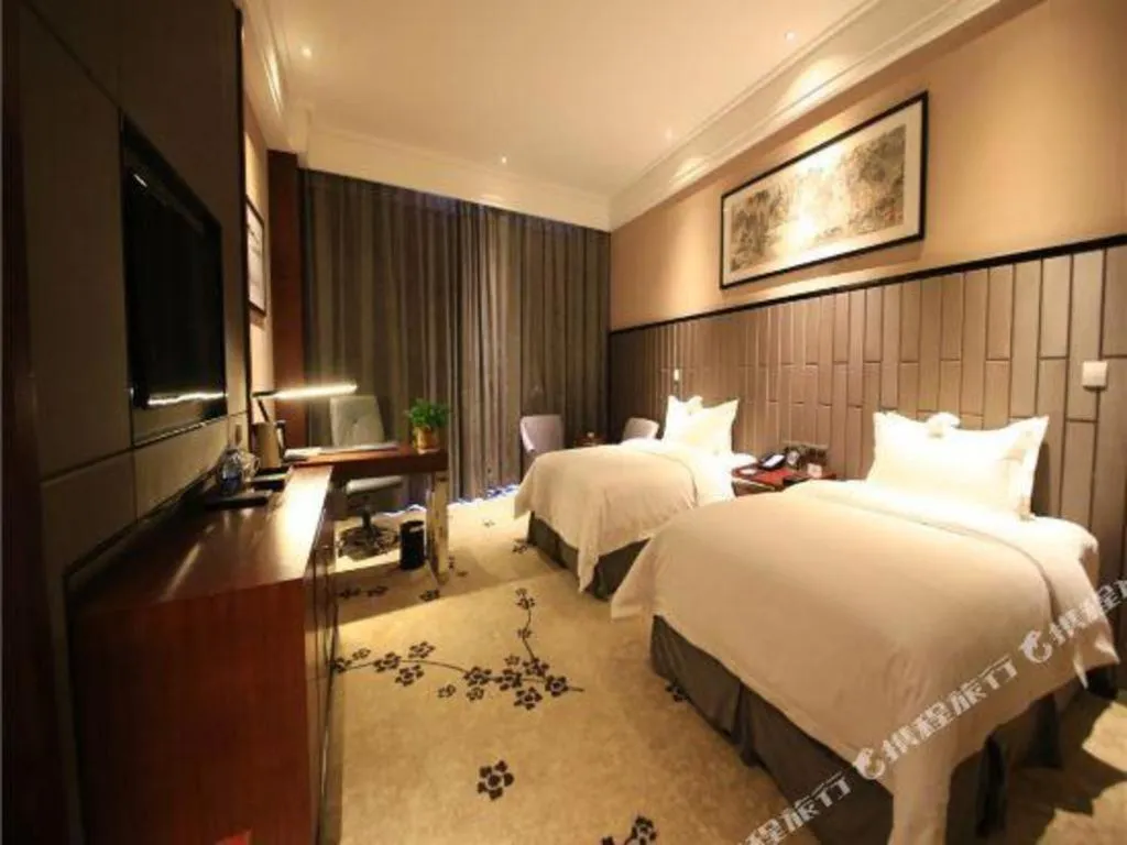 Bed in Jiyuan Oriental Jianguo Hotel