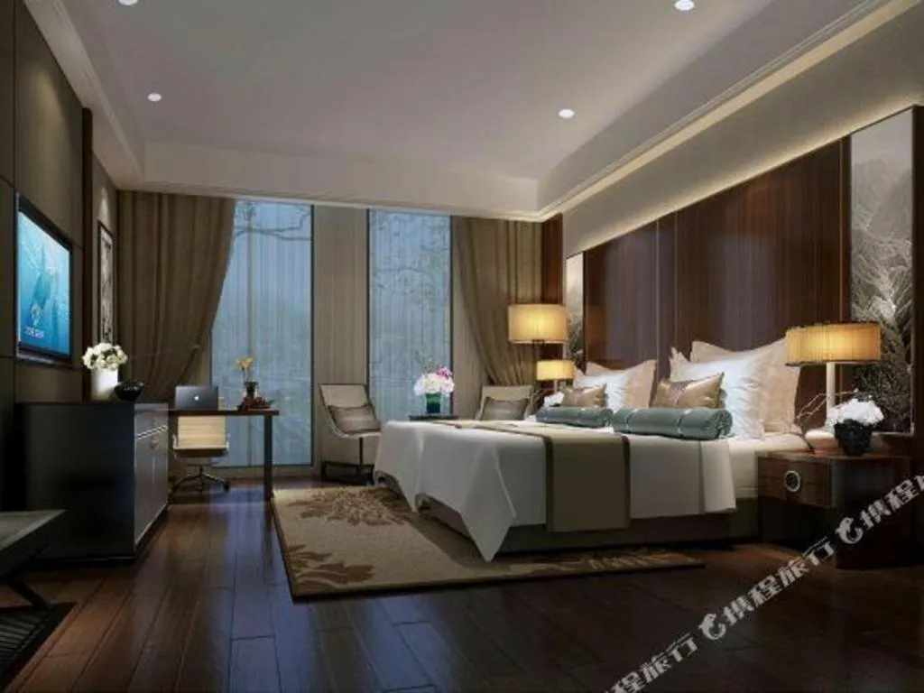 Bed in Jiyuan Oriental Jianguo Hotel