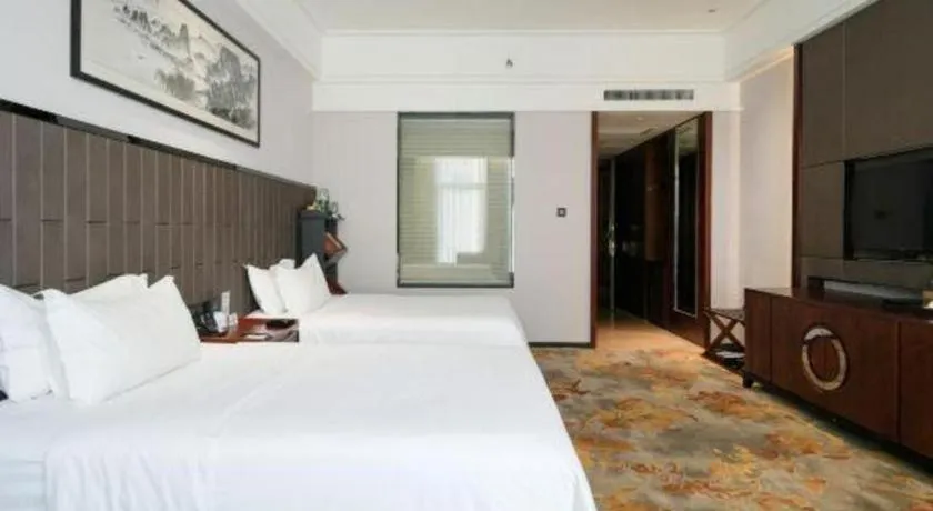 Bed in Jiyuan Oriental Jianguo Hotel