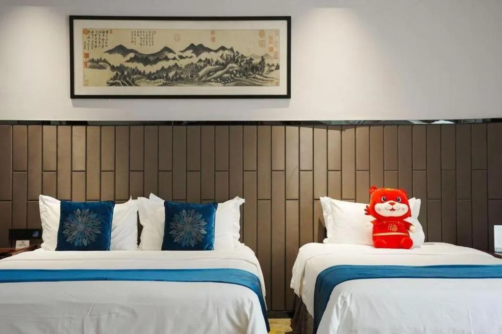 Bed in Jiyuan Oriental Jianguo Hotel