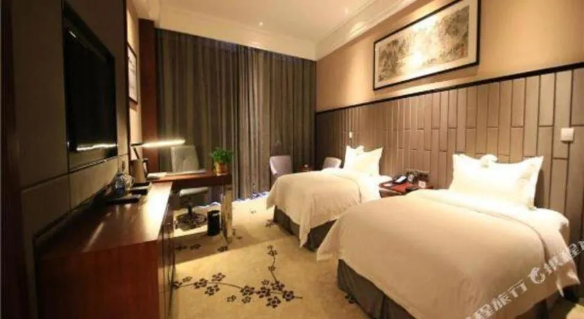 Bed in Jiyuan Oriental Jianguo Hotel