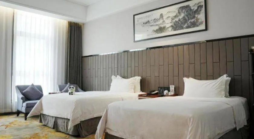 Bed in Jiyuan Oriental Jianguo Hotel